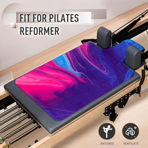 Vibrant pink and purple non-slip reformer mat cover with ventilation features