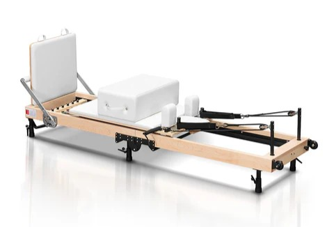 A Pilates reformer, which is a key piece of equipment used in Pilates exercises. 